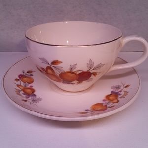 Tea cup with autumn fruit